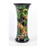 A Moorcroft vase decorated with a bird feeding her chicks, designed and painted by Paul Hildtich,