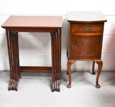 A 20th century mahogany nest of four graduated tables with bamboo style legs together with a burr