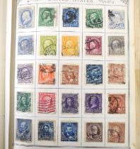 A stamp album containing British and Worldwide Victorian and later stamps, to include Penny Reds,