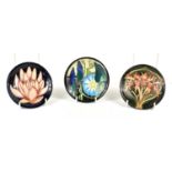 A group of three Moorcroft pin dishes, Entwined design by Emma Bossons, 2007, Florian design by