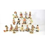 A collection of Goebel Hummel and Friedel Bavaria figurines to include Sympathetic Hunter, Boy