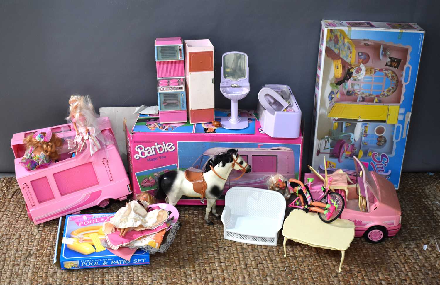 A large collection of Sindy and Barbie, dolls and accessories, including Barbie Magic Van with