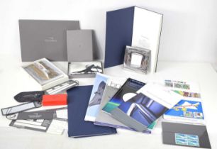 A collection of Concorde memorabilia to include boarding passes, silver photo frame by Carrs, cards,