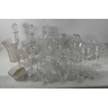 A large collection of cut glass, including three decanters, Stuart Crystal jug, a Webb Corbett vase,
