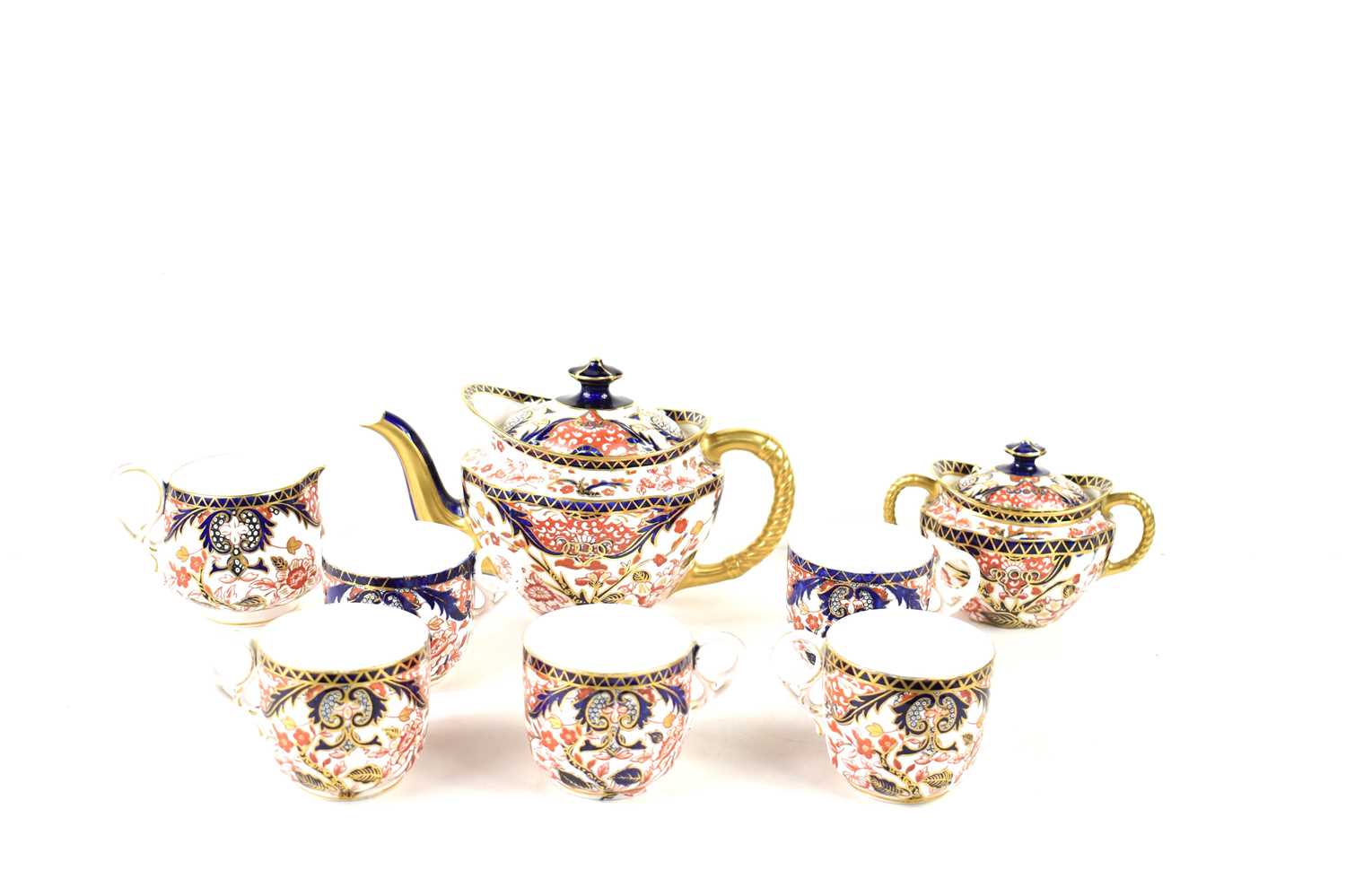 A Royal Crown Derby Imari part tea service in the 383 pattern decorated with flowers and foliage,