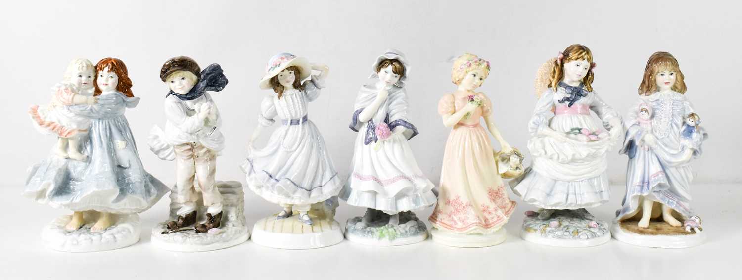 A group of Royal Worcester and Coalport porcelain figurines, to include Lullaby, Childhood Joys,