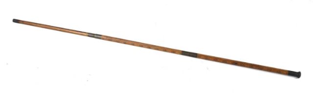 A 19th century measuring stick in the form of a walking cane, possibly for measuring casks, made