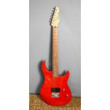 A Peavey Raptor Junior Electric Guitar in red.