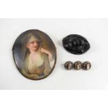 A 19th century miniature portrait brooch / pendant, likely French, the porcelain plaque hand painted