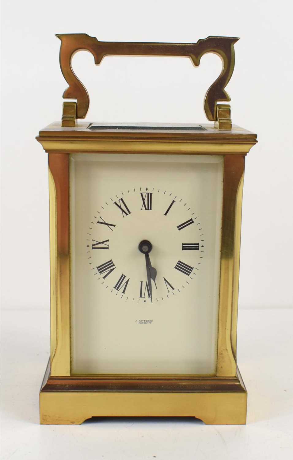 A brass cased carriage clock retailed by A Fattorini, Harrogate, 11.5cm high.