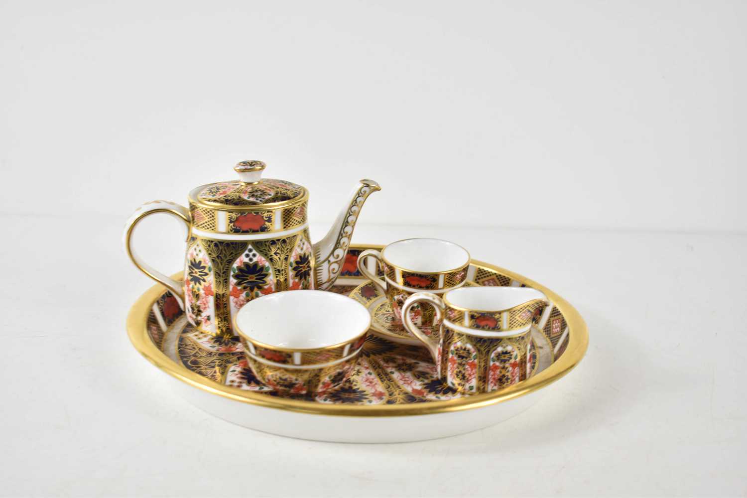 A Royal Crown Derby miniature tea set, in the Imari pattern number 1128, comprising oval tray, tea - Image 3 of 3