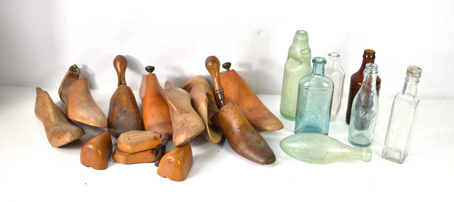 A group of vintage wooden shoe lasts, various shapes and styles together with a collection of