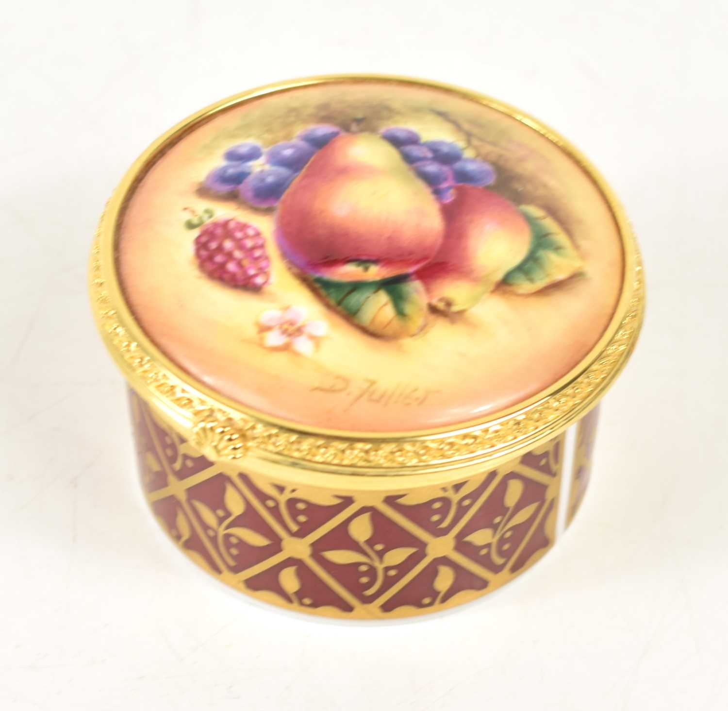 A Royal Worcester handpainted trinket box, the domed top painted with fruit and signed D.Fuller, the