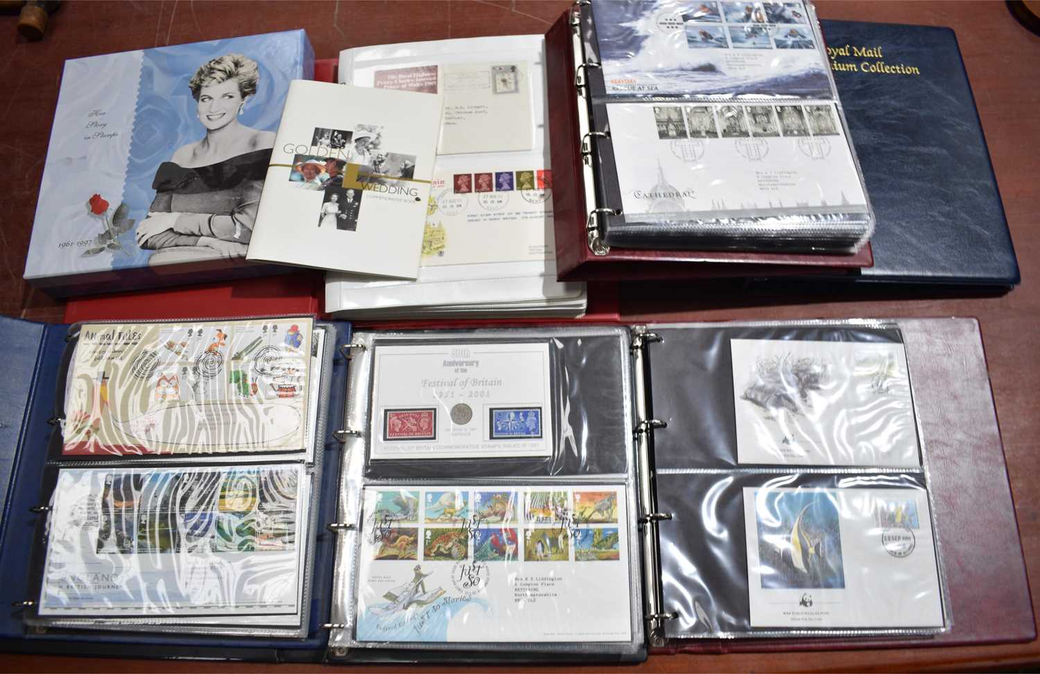 A large collection of First Day Covers and some stamps to include Princess Diana Her Story in