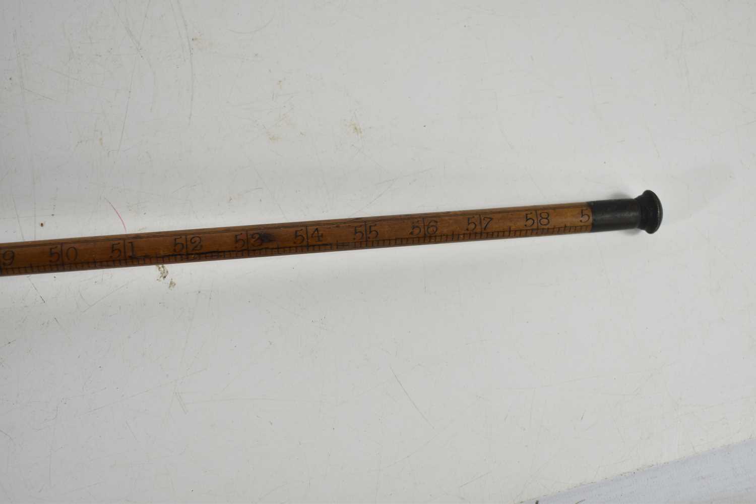 A 19th century measuring stick in the form of a walking cane, possibly for measuring casks, made - Image 4 of 4