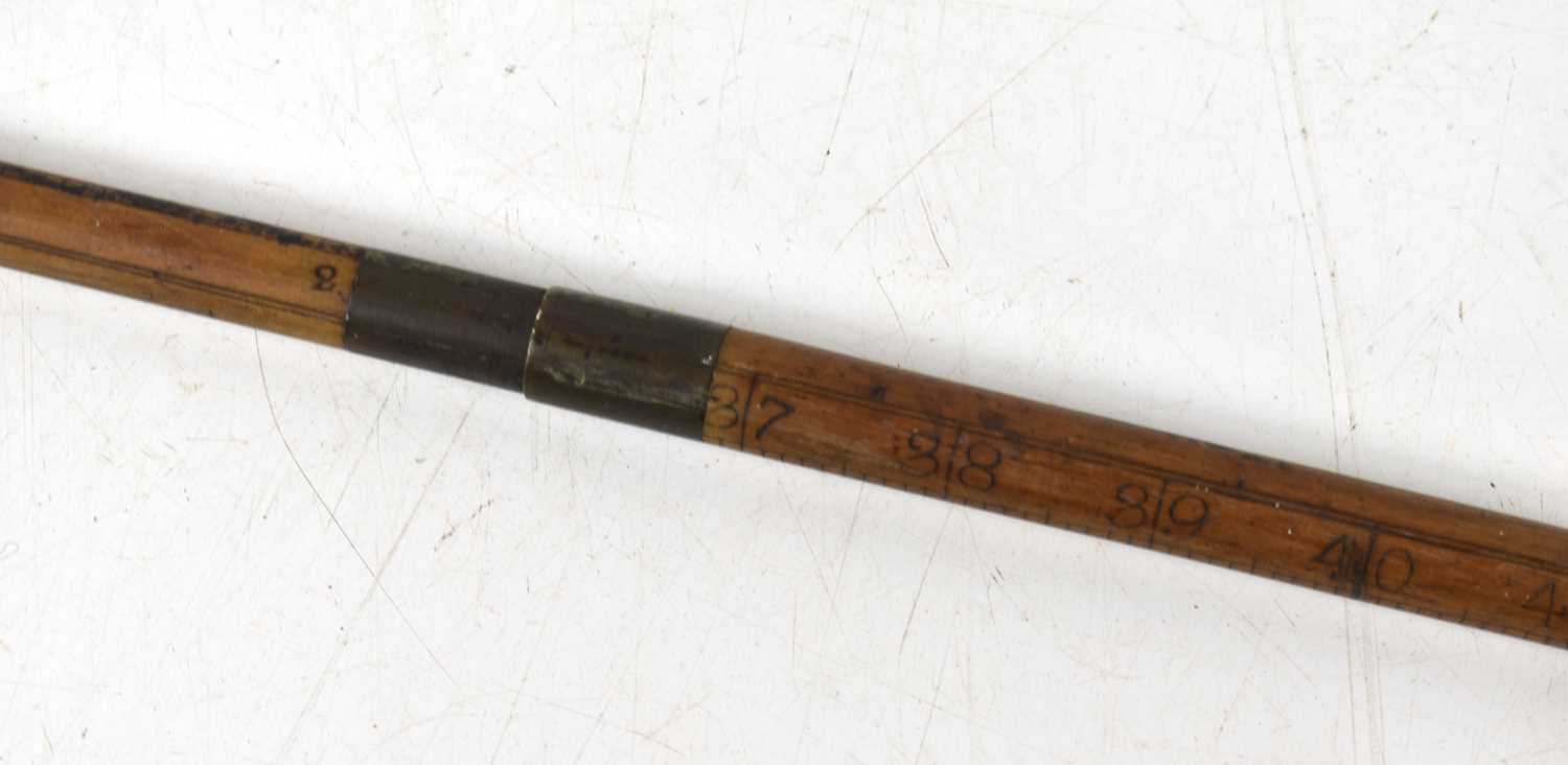 A 19th century measuring stick in the form of a walking cane, possibly for measuring casks, made - Image 2 of 4