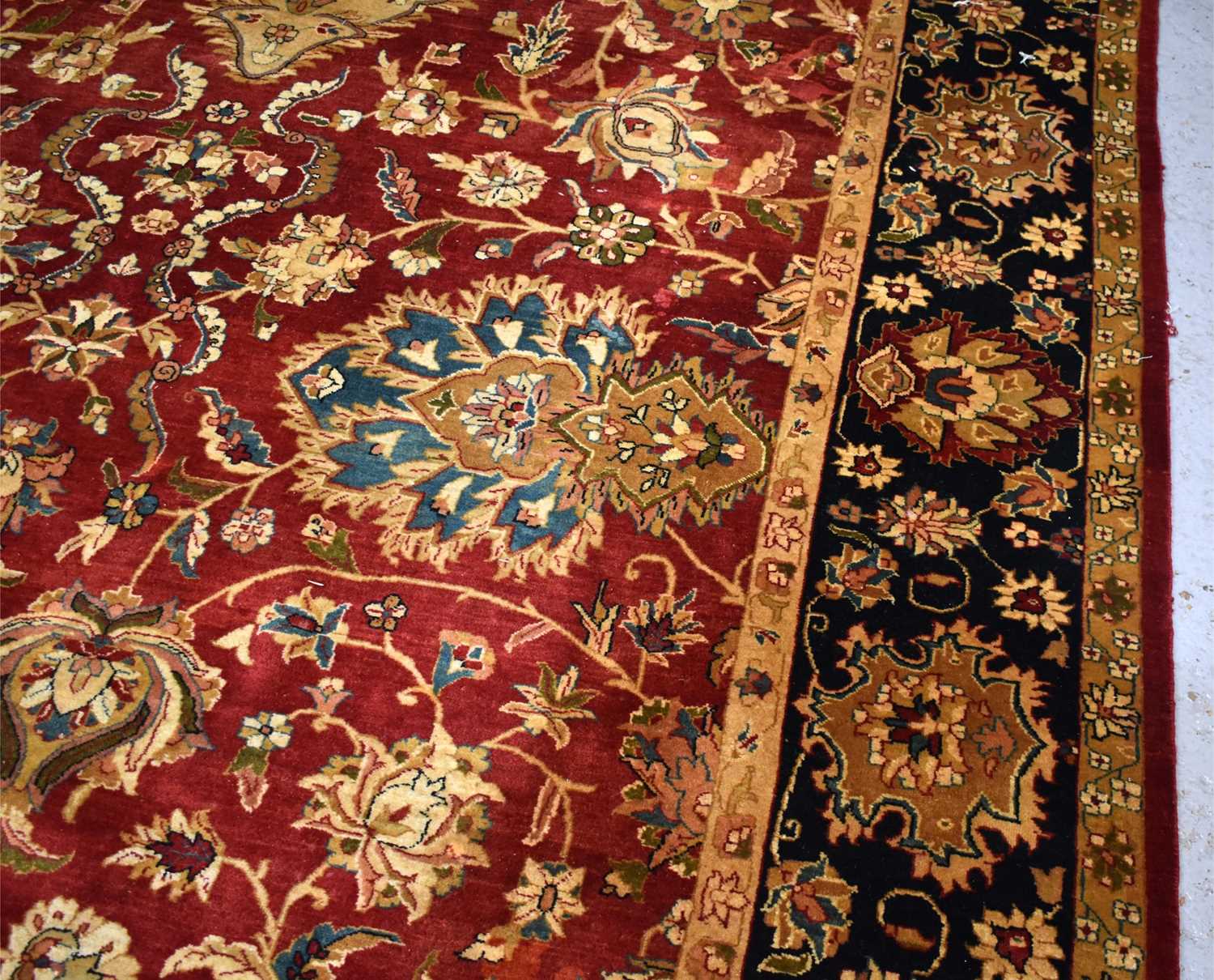 A 20th century Chinese hand woven wool rug retailed by Oriental Rug Gallery, the central red - Image 3 of 3