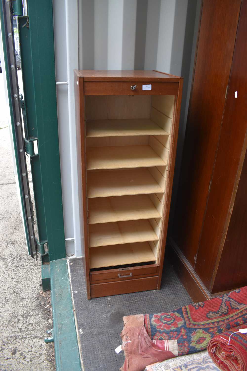 A tambour fronted coin cabinet with 6 shelves, 119cms tall by 44cms wide by 38cms deep - Image 2 of 2