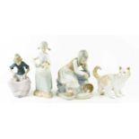 Four Nao porcelain figures comprising girl with spilt milk pale, girl with kittens, girl with