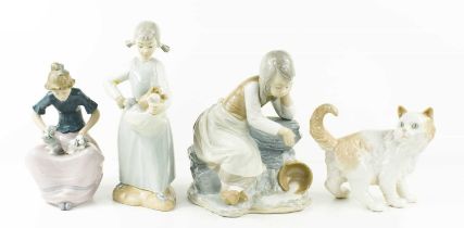 Four Nao porcelain figures comprising girl with spilt milk pale, girl with kittens, girl with