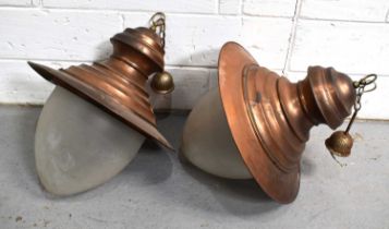 A pair of large industrial coppered metal lanterns with opaque glass shade, 76cm high.
