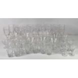 A part suite of cut glass tablewares comprising five large goblets, six tall wine glasses, six