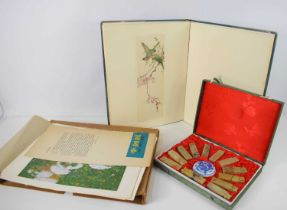 A Chinese book of paintings, fully illustrated with colour prints, together with a set of