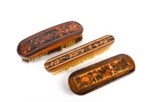 Three Georgian early 19th century Tunbridge ware clothes brushes, all having floral panels of