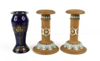 A pair of Doulton Lambeth candlesticks, by Ethel Beard (Senior Assistant 1890 to 1930's) stamped