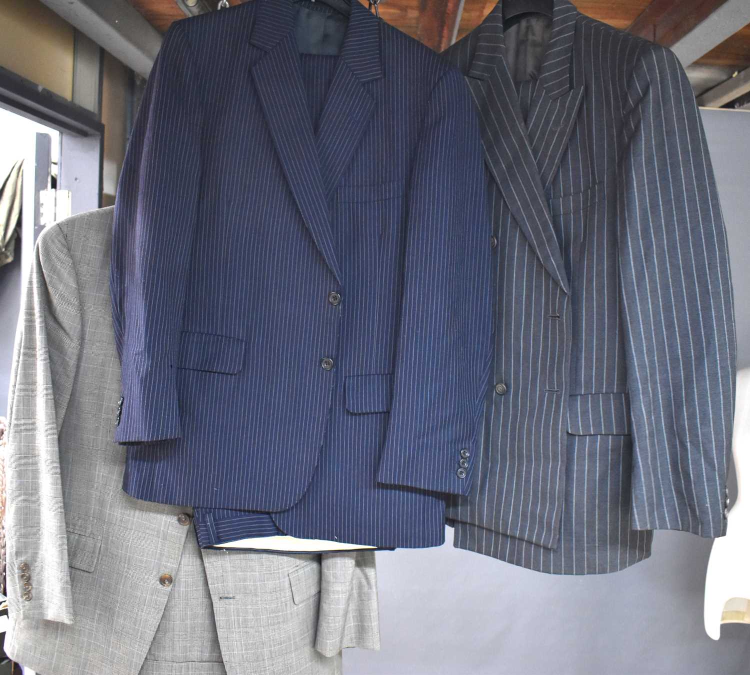 Two vintage Aquascutum pinstripe suits together with a Ralph Lauren suit.