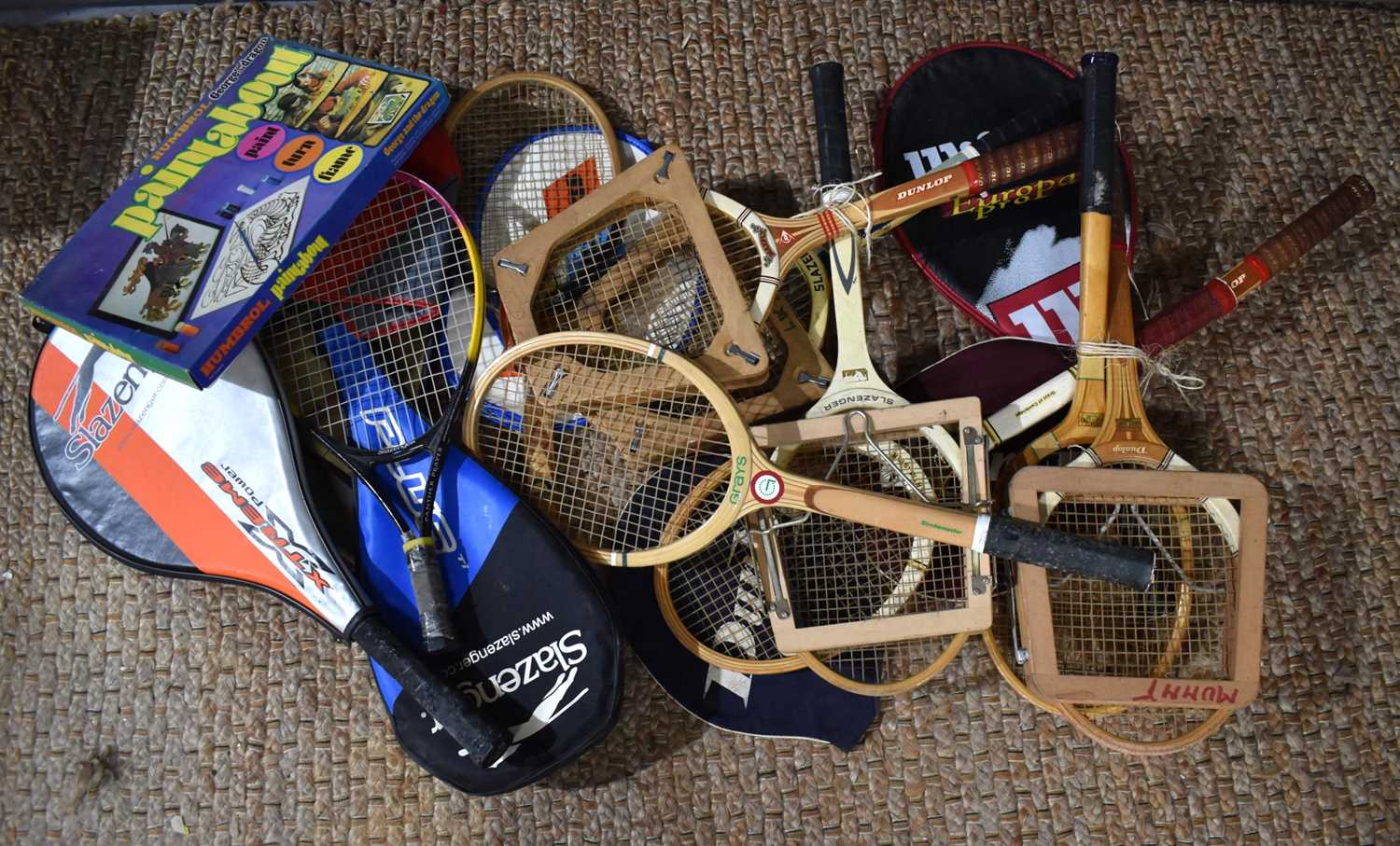 A large collection of 20th century tennis racquets including some wooden examples and later by
