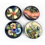 A group of four Moorcroft pottery dishes, to include one by Emma Bossons dated 2005, two by Rachel