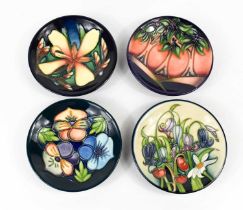 A group of four Moorcroft pottery dishes, to include one by Emma Bossons dated 2005, two by Rachel