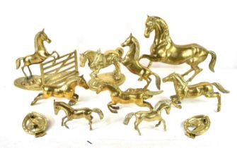 A collection of brass horse ornaments together with two brass horse door knockers.