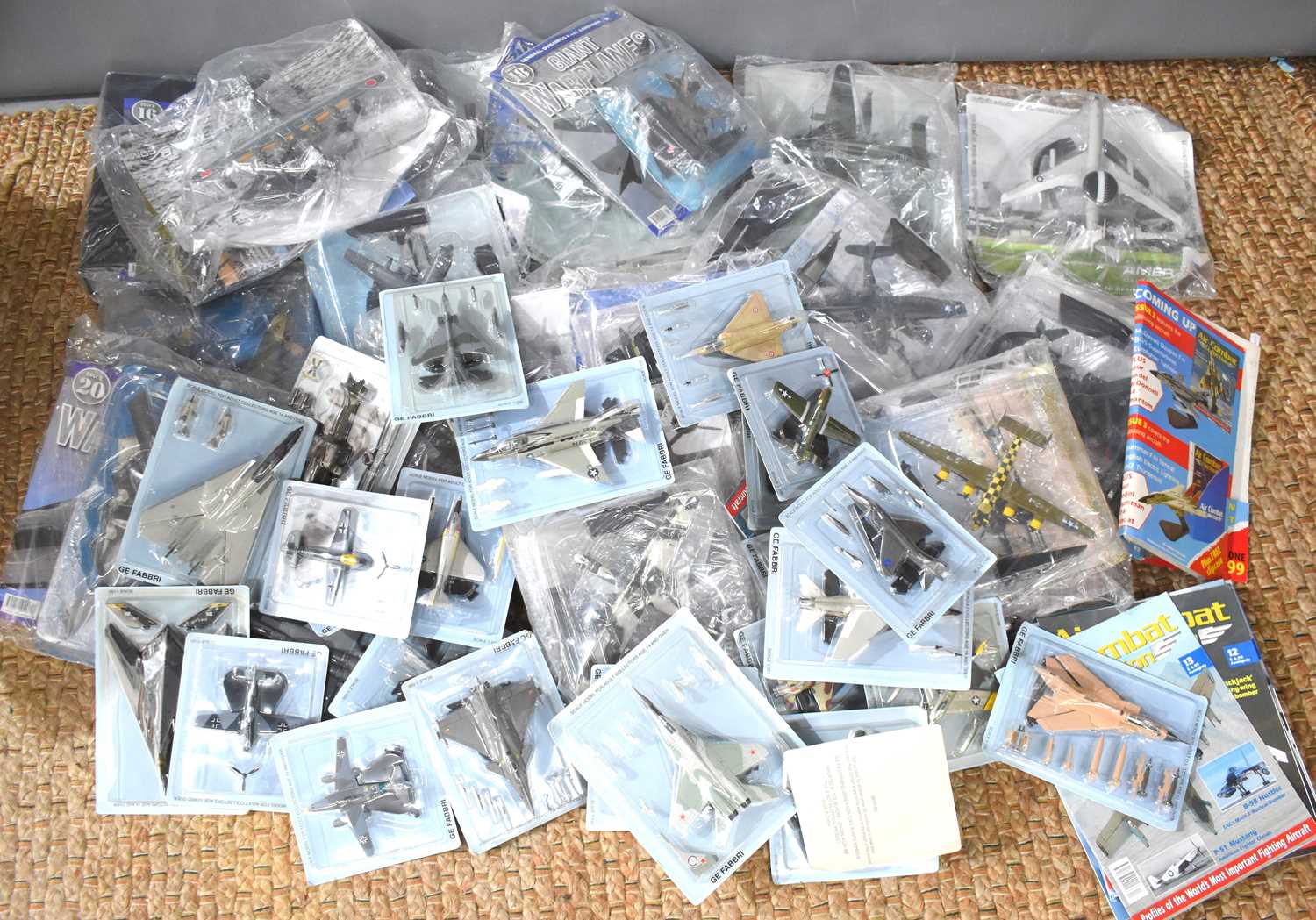 A large quantity of Air Combat Collection die cast models, and magazines, all still boxed,