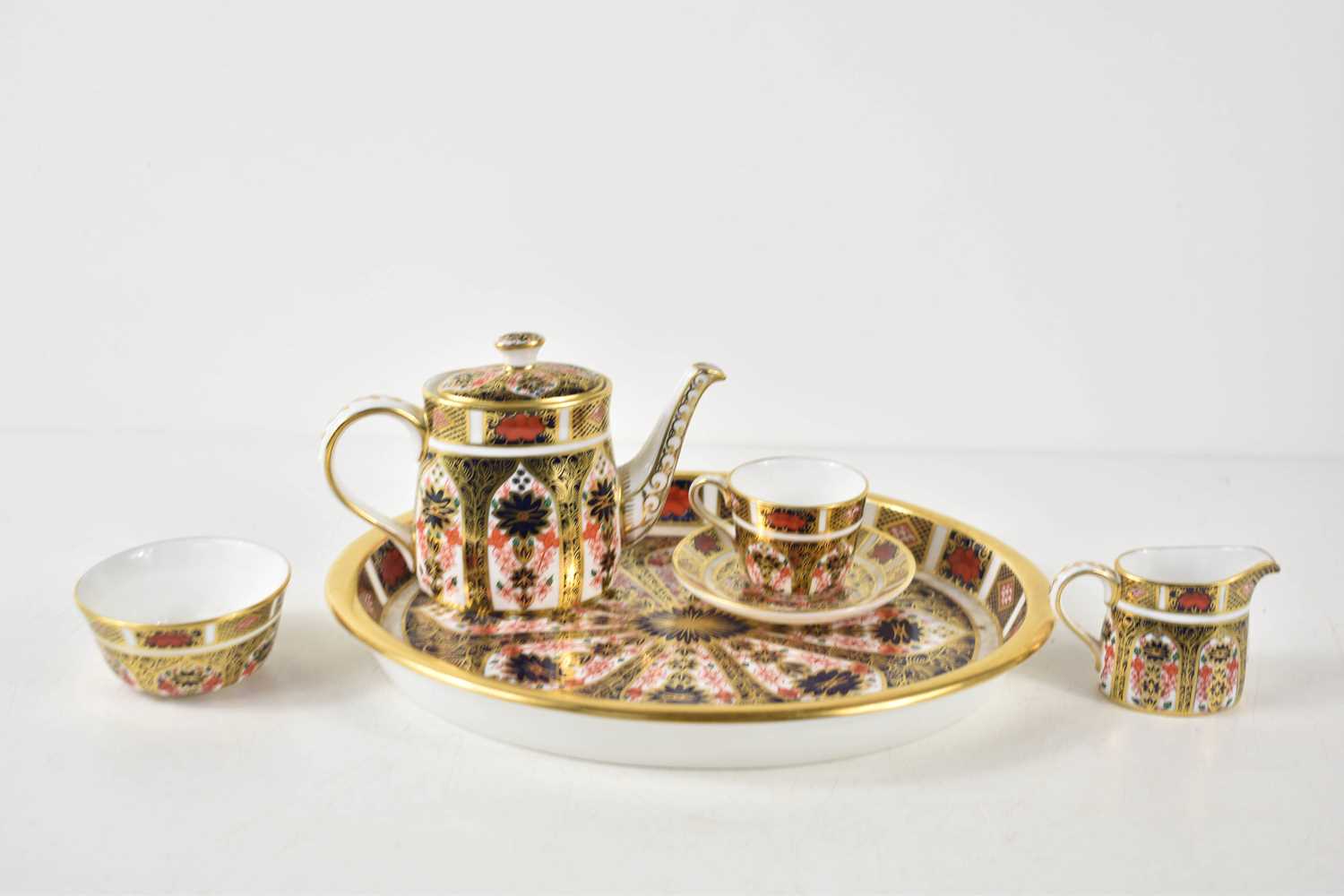 A Royal Crown Derby miniature tea set, in the Imari pattern number 1128, comprising oval tray, tea - Image 2 of 3