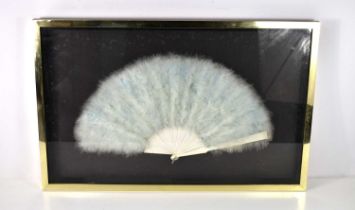 A late 19th century fan, in the manner of Duvelleroy, the blue silk leaf with swan feathers and bone