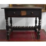 A 17th century oak side table with single geometric moulded drawer and bobbin turned front rail