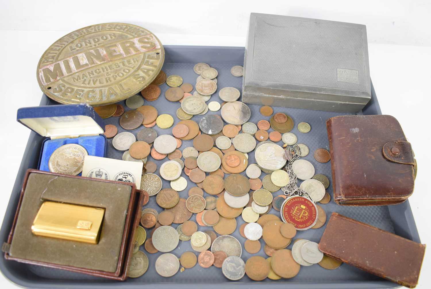 A selection of coins and collectables to include a Duckhams presentation medallion, commemorative