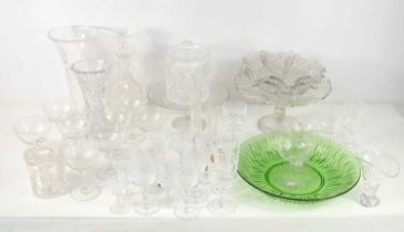 A collection of vintage and later coloured and cut glass wares, including vases, bowls, star cut