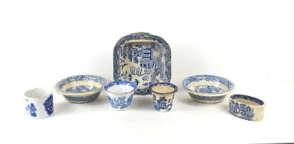 A group of 19th century blue and white willow pattern ceramics, mostly Staffordshire, including a