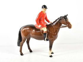 A Beswick huntsman on standing bay horse, model number 1501, designed by Arthur Geddington in
