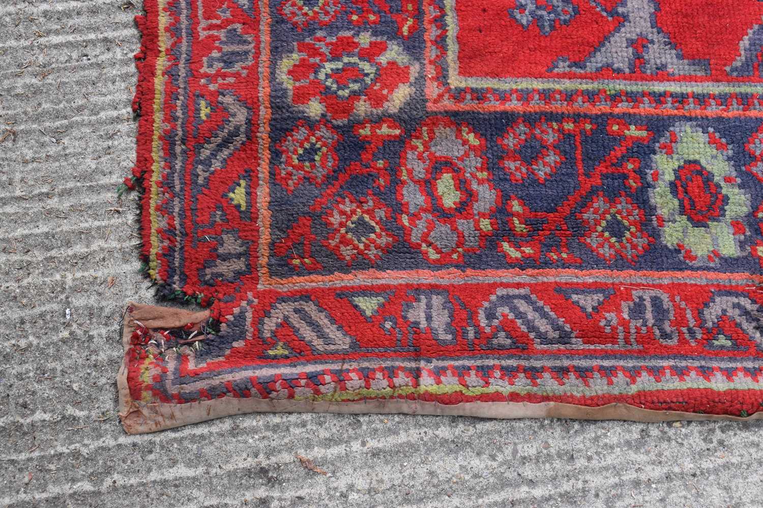 Two antique wool rugs likely Middle Eastern origin both with red ground and stylised motifs and - Image 7 of 13