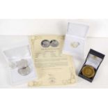 A 2019 silver sovereign with certificate together with a gold plated commemorative coin, a silver