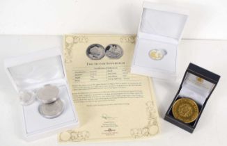 A 2019 silver sovereign with certificate together with a gold plated commemorative coin, a silver