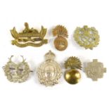 A group of Victorian and later cap and pouch badges to include Gordon Highlanders, 64th Foot