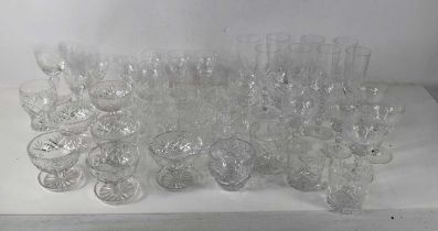 A suite of apparently unmarked cut-glass glasswares, comprising eight champagne flutes, and wine