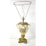 A 19th century French Sevres style porcelain and gilt metal table lamp, the body having twin