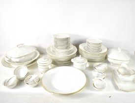 A Limoges France part dinner service, the plain white ground with gilded highlights comprising eight