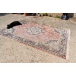 Two similar wool and silk blend rugs profusely decorated with stylised flora and foliage both a/f,